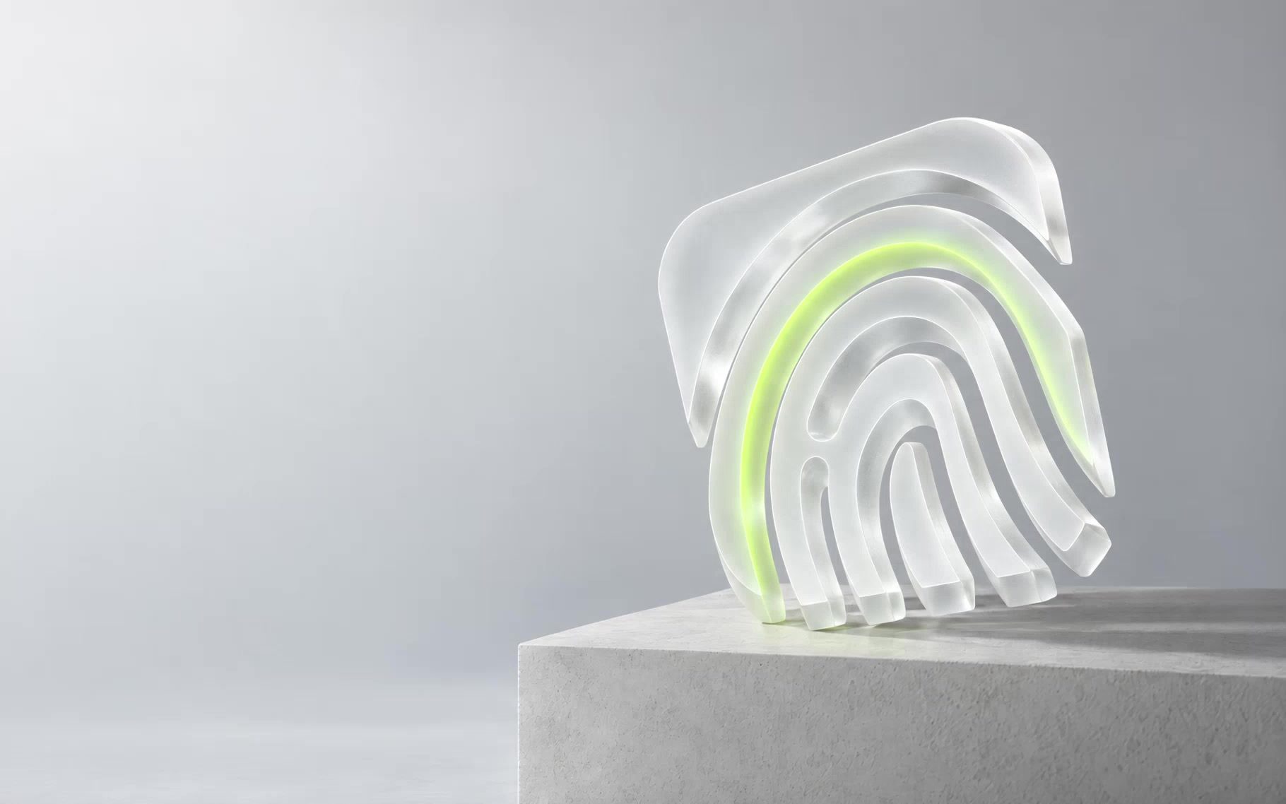 Sculptural glass fingerprint illuminated by an electric lime line on pale stone